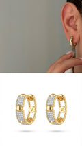 Gold CZ Pave V Logo Huggie Hoop Earrings - CW1VPEARNG00192 | Wholesale Stainless Steel Jewelry Catwalk Jewellery Europe