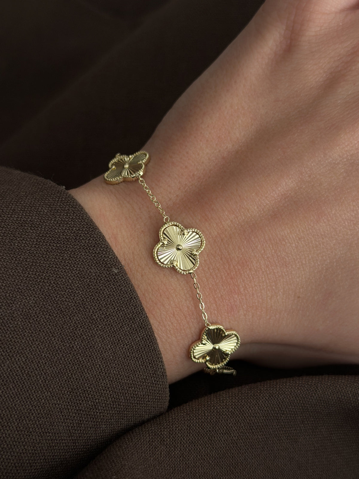 CW1VPBRCLT0016-gold-guilloche-clover-motif-station-bracelet-alternate-angle-catwalkjewellery wholesale jewelry BRACELETS  Catwalk Jewellery Europe