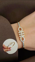 Gold CZ Pave Infinity Knot Buckle Hinged Cuff Bangle - CW1CUFF0015 | Wholesale Stainless Steel Jewelry Catwalk Jewellery Europe